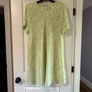Summertime swing dress. Sheer yellow fabric over a floral print. Size 1X